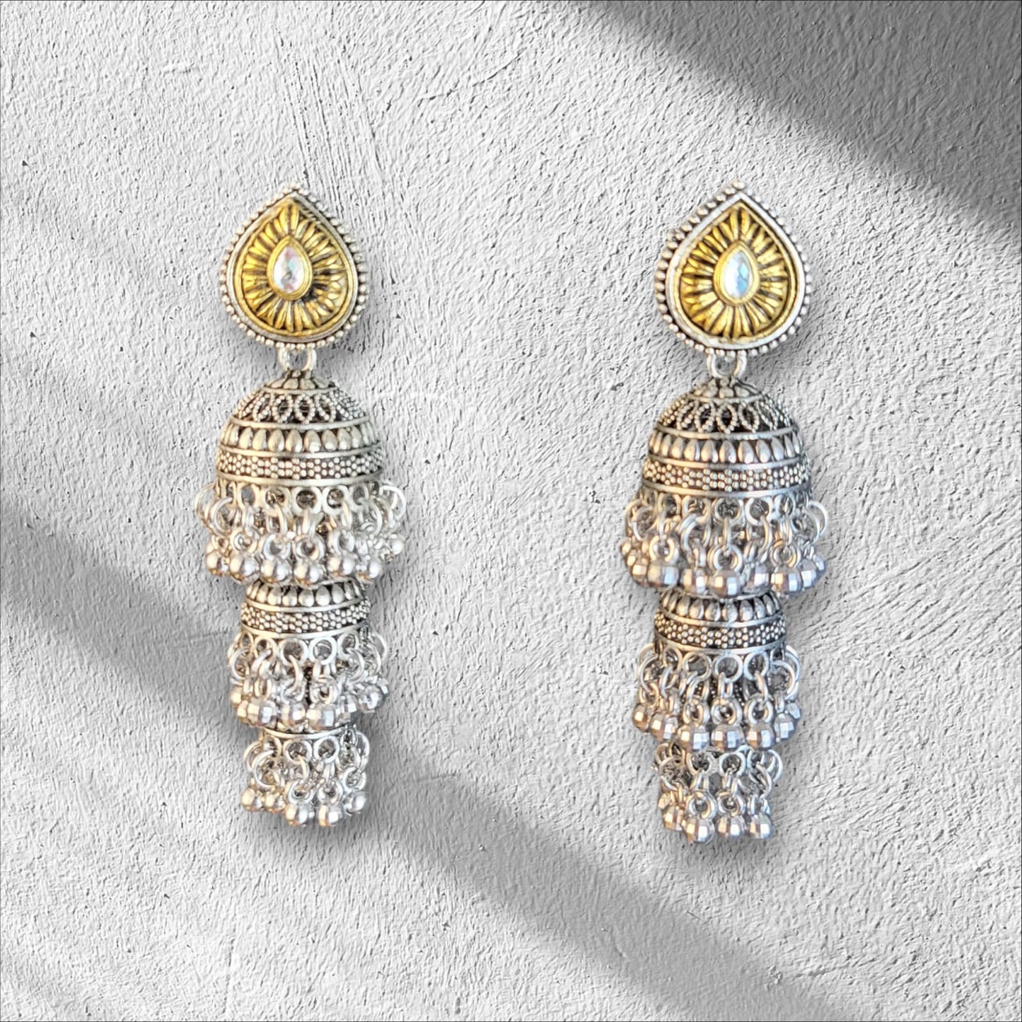 MIDAM™ Silver and Gold Plated 3 Layered Jhumka Earrings