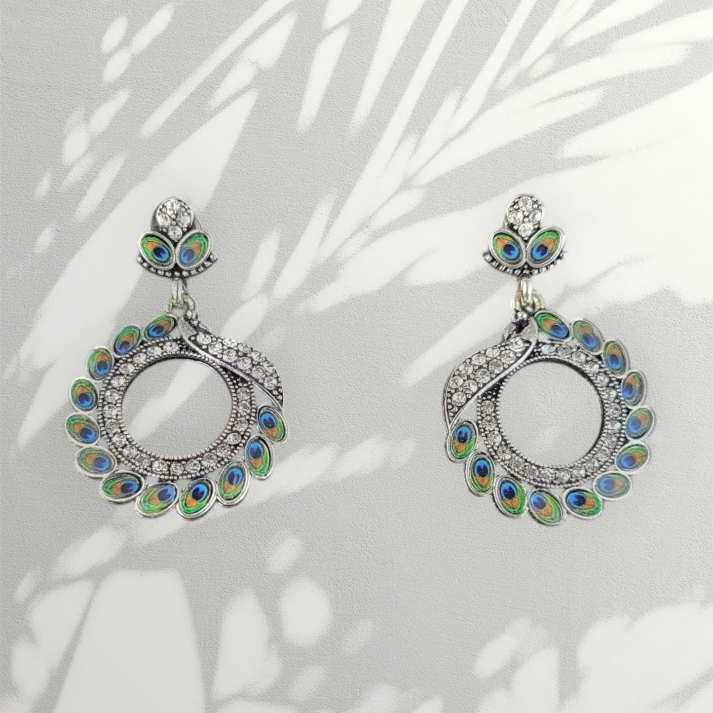 MIDAM™ Silver-toned AD Studded Circular Peacock Shaped Drop Earrings